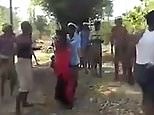 Woman in India wails in distress at site of public beating
