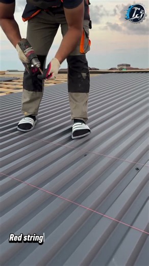 Screwing Down Ribbed Metal Roof Sheets 🔧🏠 #metalroof #roofing #construction