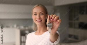 Blond woman realtor real estate agency worker make special offer show to camera bunch of keys, symbol of affordable dwelling, close up. Happy homeowner, purchase of first property, moving day concept