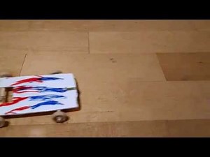 A DIY pull-back car a child can make using a retractable badge holder