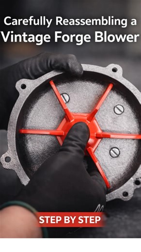 Carefully reassembling a vintage forge blower step by step