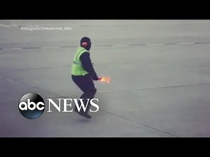 Airline worker's dance moves bring smiles and goes viral