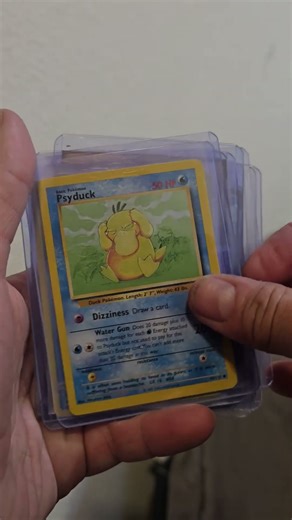 Showing off youre weird Pokémon Psyduck card collection. #pokemon
