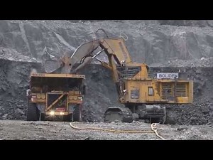 Komatsu PC 5500 loading Caterpillar 793 D