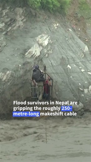 Survivors cling to zipline after Nepal floods destroy bridges