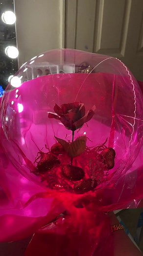 DIY Clear Balloon Bouquet I filled a clear balloon with all materials from the dollar tree! The clear balloon is from Amazon, it can inflate up to 24 inches. Make sure you tie it tight because it will deflate! Once its completely inflated, twist the end really tight and tape it so it doesn’t unravel and leak out any air. (Or tie it in a knot) I attached it to a balloon stick and wrapped with gift bag plastic around it but you can use tissue also to give it a bouquet look. #DIY #valentinesday #va