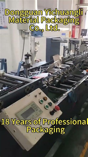 We are Dongguan Yichuangli Material Packaging Co., Ltd. The machine gluing boxes in process.