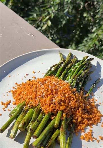 Recipe ⤵️ If you don’t like asparagus you need to grow UP and make my chili oil panko crusted asparagus 😩 Ingredients: Asparagus: - 1 bunch asparagus (washed & dried cut off about an inch off the bottom of each stalk) - 2-3 garlic cloves - 1/2 tbsp olive oil - 1 tsp soy sauce - pinch pepper - 1/4 tsp sesame oil - 2 tbsp butter Panko Crust: - 1/2 c panko breadcrumbs - 1/2 tsp pepper - Parmesan measure with your heart - 2 tsp chili crunch - 1 tsp olive oil Directions: 1. Heat olive oil over mediu
