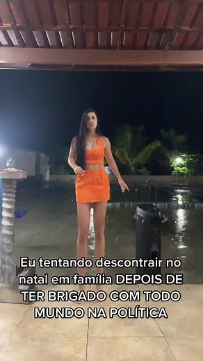 Nighttime Poolside Dance in Orange Outfit