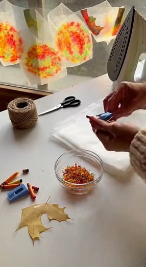 Wax Paper Leaf Suncatchers Materials Needed: Wax paper sheets Crayons (various fall colors: red, orange, yellow, green, brown) Pencil sharpener or grater (for shaving crayons) Leaves (real or paper leaf templates) Scissors Iron Thin towel or parchment paper (to protect the iron) Hole punch (optional) String or yarn (for hanging) Instructions: Step 1 - Prepare the Crayon Shavings Peel the paper off your crayons. Use a pencil sharpener or grater to create small color shavings. Mix colors like red,