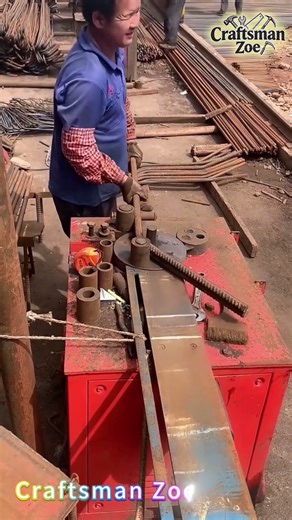 The steel bar bending machine at the construction site bends threaded steel bars