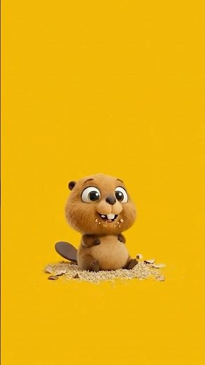 A cute little beaver is eating its way through a pile of logs