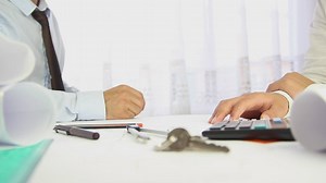 Two men closing a deal and giving some keys - Free Stock Video