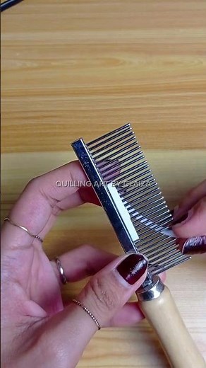 The comb technique brings each petal to life with symmetry and charm #QuillingArt #CreativeCrafts
