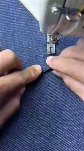 Professional Tailor Sewing Decorative Pocket On Blue Jeans