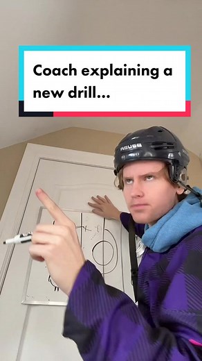 Coach Demonstrating Hockey Drill to Players