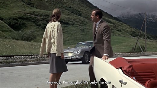 On the picturesque Furka Pass in the Swiss Alps, Bond (Sean Connery) meets Tilly Masterson (Tania Mallet) in GOLDFINGER. | James Bond 007