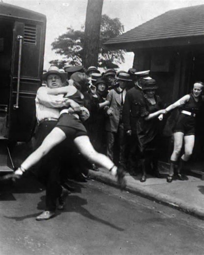 The powerful photograph often dated to the 1920s–1930s in the United States captures exactly that reality: a woman being physically escorted away at a public swimming area because her.. check bio link | Infamou Boundaries