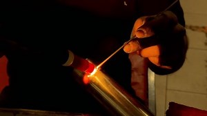 Welder joins two metal pipes using a tungsten inert gas (tig) welding technique