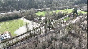 Cinematic 4K bird's-eye drone shot of flooded fields, flooding on the Duwamish, Green River near the Neely Mansion in Auburn, King County Washington