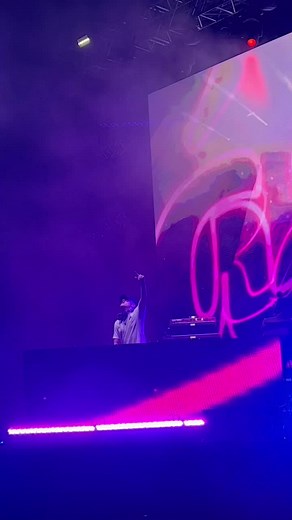 Exciting DJ Performance with Vibrant Lights and Graphics