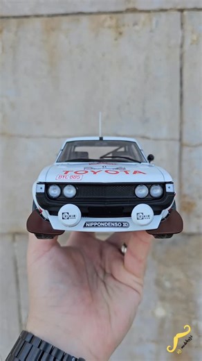 Toyota Celica 2000 GT (RA21) No. 8 RAC Rally 1977 - IXO Models / 1:18 / IXO Modelcars / IXO18RMC189A.22 The Toyota Celica 2000 GT (RA21) No. 8 from the 1977 RAC Rally represents an early and important chapter in Toyota’s European rally efforts. Driven in the demanding British forest stages, the RA21 showcased Toyota’s growing ambition to challenge established rally teams with a lightweight, rear-wheel-drive platform powered by a lively 2.0-liter engine. Though not yet the dominant force Toyota w
