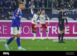 Gelsenkirchen, Germany. 20th Jan, 2024. Soccer: Bundesliga 2, FC Schalke 04 - Hamburger SV, Matchday 18, Veltins Arena. Hamburg's Immanuel Pherai (center l) celebrates his goal for 0:1 with teammate Ignace Van der Brempt. Credit: Tim Rehbein/dpa - IMPORTANT NOTE: In accordance with the regulations of the DFL German Football League and the DFB German Football Association, it is prohibited to utilize or have utilized photographs taken in the stadium and/or of the match in the form of sequential im