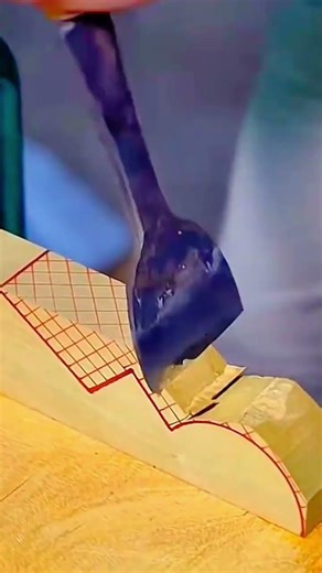 carving detailed joints on wood with grid patterns using a metal chisel for manual craftsmanship