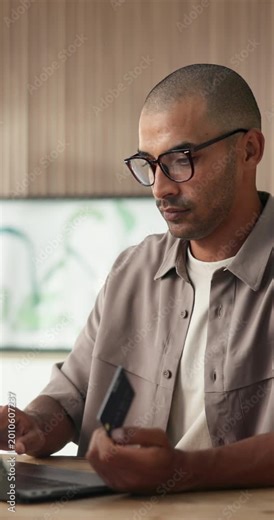 Man, credit card and laptop at office with online shopping, fintech and easy transaction at company. Person, budget and payroll manager for e commerce, typing and computer with glasses at agency