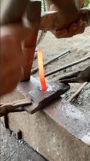 Braid-locking dried palm fronds into traditional hand fan frames