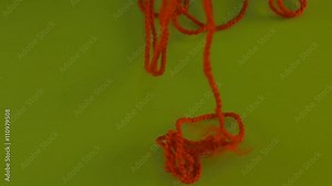 Red Tangled Threads of Wool Fall Down on Green Screen Colorful Fiber Someone is Pulling Filament Threads Are Moving Someone is Pulling the Thread