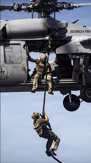 Fast Roping from an United States Navy MH 60R Sea Hawk Helicopter at Sea