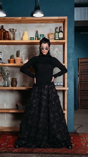 BeaA Black Line Long Skirt: The New Evening Essential There’s something undeniably captivating about a piece that moves with you—softly, elegantly, without demanding attention. BeaA’s Black Line Long Skirt is exactly that kind of wardrobe treasure. Crafted in a deep black tone, the skirt features a comfortable elastic waistband, delicate star motifs, and fine fringes that sway with every step. A sheer layer drapes effortlessly over a subtle lining, creating a look that is both feminine and moder