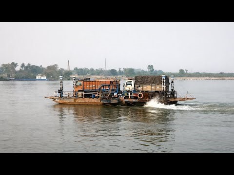 Monster Trucks Loaded on Giant Vessal | Rare River Crossing Scene