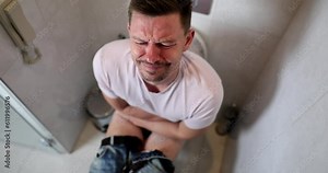 Man with problems in toilet constipation and diarrhea. Food poisoning symptoms in adult