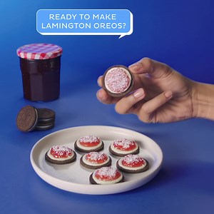 Try an OREO lamington twist with the family. Make OREO lamingtons by dipping OREO cookies into jam and then coconut flakes 😋 | OREO