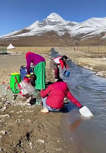 3.8M views · 138K reactions | Local Tibetans near Kang Rinpoche Mount Kailash fetching water from the holy mountain during the winter. | Tours & Travel Service - Tibet Travelers | Facebook