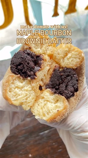 Dun-Well Doughnuts on Instagram: "Bourbon brownie batter filled donuts! 🥃 • maple bourbon brownie batter: maple bourbon glazed donut with maple sugar dusting & bourbon brownie batter filling #donuts #donut #browniebatter"