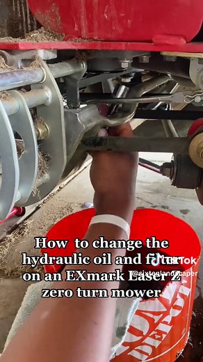 How to change the hydraulic oil and filter on an eXmark zero turn mower. Step 1. Lift the mower from rhe back. Step 2. Remove the tires for the best angle to reach the hydraulic filter. Step 3. Remove the filter to drain the oil. Step 4. Add the new filter. Step 5. Add fresh oil. Step 6. Check to make sure oil level is on full. #sixtenlandscaper #fyp #foryou #lawntok #mowers