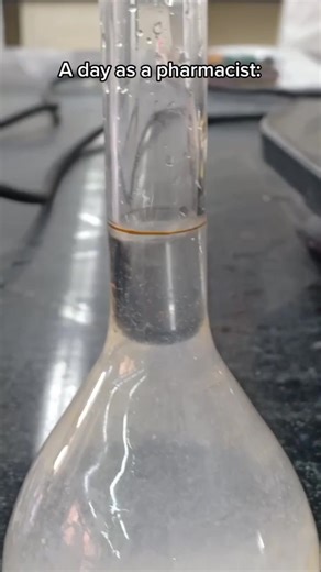 Pharmacist Demonstrates Liquid Mixing Techniques