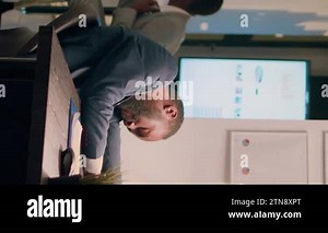 Vertical video Drowsy accountant sleeping in office, being woken up by colleague shocking him. Worker scaring unsuspecting tired coworker, shaking him up in his desk chair during nightshift Stock Video Footage - Alamy