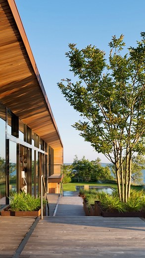 The North America Series • Video Feature • Designed to be a family holiday home, Peconic House by @studiomapos offers its owners space to live, entertain, have fun and, most of all, connect with each other. With split-level living, Peconic House holds the heart of the home, the kitchen, upstairs along with the master suite and living spaces while downstairs is the children’s and guests rooms. Additionally, the home features a large lap pool and a green roof with an overhanging sycamore tree that