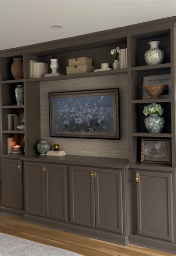 One of our favorite DIY’s yet..built in on this boring blank wall! Check out our page we have 3 part series on step by step how to do this including an additional video on crown molding. @benjaminmoore Color: Whitall Brown #diyhome #builtin #homerenovation