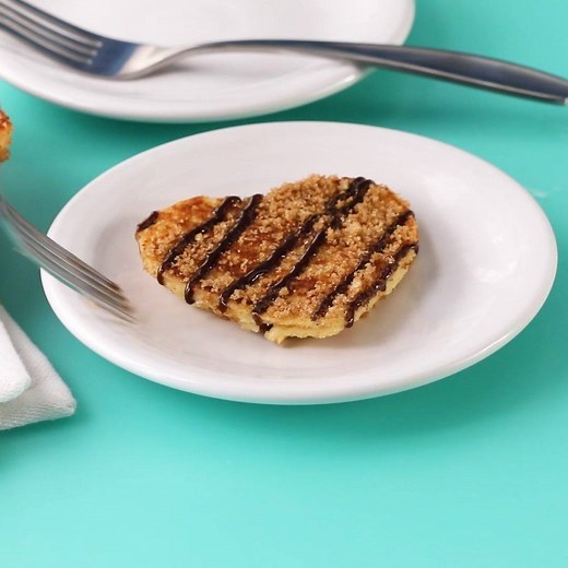 These Chocolate-Stuffed Churro French Toast Hearts are perfect for any special occasion. Bonus: it only takes about 25 minutes to make from start to finish! GET THE RECIPE: https://trib.al/SDpOC3n | Better Homes & Gardens