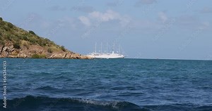 Virgin Gorda Caribbean ocean bay sailing cruise ship from boat. Commonwealth of the United Kingdom, British Virgin Islands. Cruise ship vacation destination. Resort, yacht, sailboat harbor and marina.