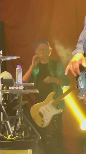 Keith Richards Taking a Smoke Break at a Rolling Stones Show