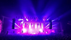 Premium stock video - A vibrant concert performance with a large crowd and a captivating stage show