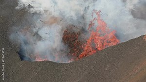 Beautiful volcanic landscape of Kamchatka: eruption active Tolbachik Volcano - effusion from the crater lava, gas, steam, ash and volcanic tremor, earthquake. Russia, Far East, Kamchatka Peninsula.