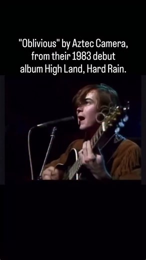 @thequakefm99sanfrancisco on Instagram: ""Oblivious" by Aztec Camera, written by Roddy Frame, is a signature track from their 1983 debut album High Land, Hard Rain, known for its catchy, acoustic-driven sound, cheerful pessimism, and flamenco-style guitar solo, which contrasted sharply with typical 80s synth-pop and became a UK hit, peaking at #18 after a successful re-release. The song captures themes of loneliness, anticipation, and the search for genuine connection, delivered with youthful vi