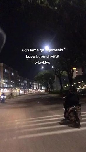Nighttime Motorcycle Ride Through Urban Streets